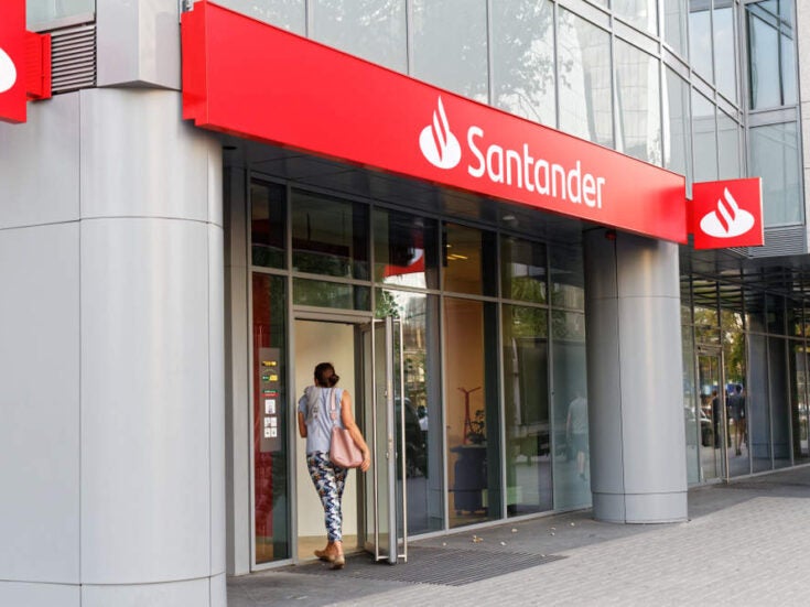 Santander reports drop in net profit due to restructuring